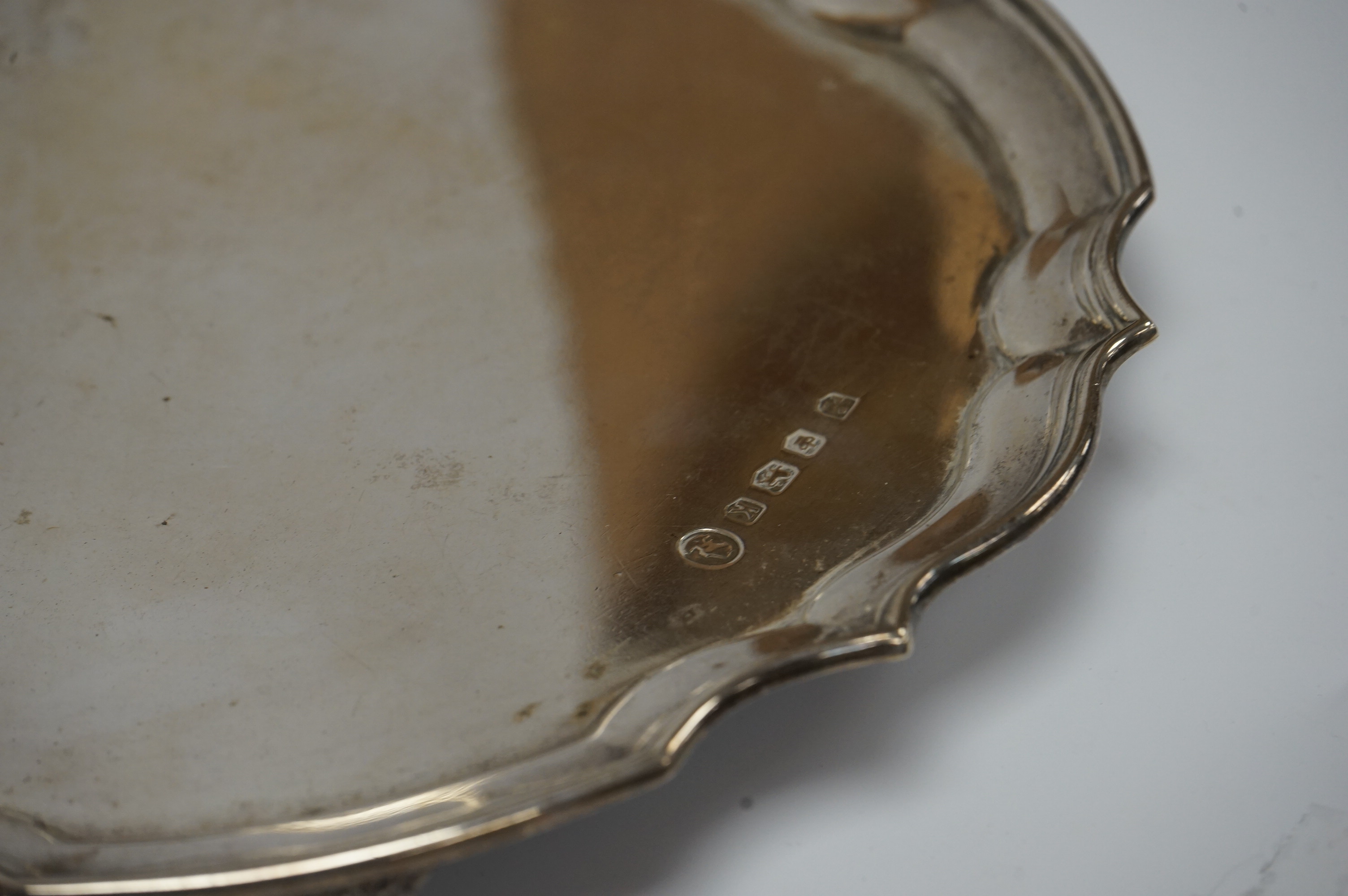 An Elizabeth II silver salver, by Poston Products Ltd, Sheffield, 1952, 25.4cm, with pie crust border, on four claw and ball feet, 17oz. Condition - fair to good